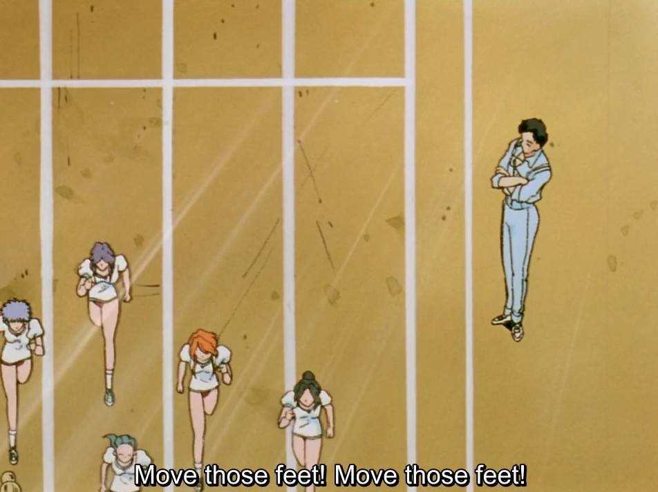 The same overhead shot of girls running laps past a teacher with folded arms, this time with the fansub’s translation. The subtitle reads “Move those feet! Move those feet!”