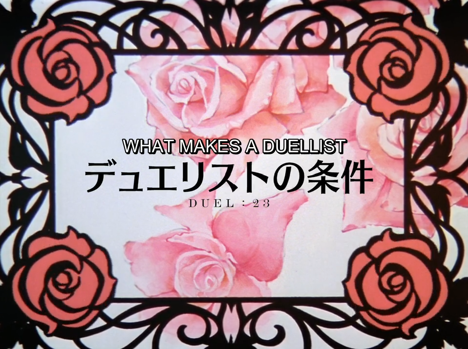 The episode 23 title card: large pink roses framed by black wrought iron with a coral rose in each corner. The English title reads "WHAT MAKES A DUELLIST" above the Japanese "デュエリストの条件" and "DUEL : 23".