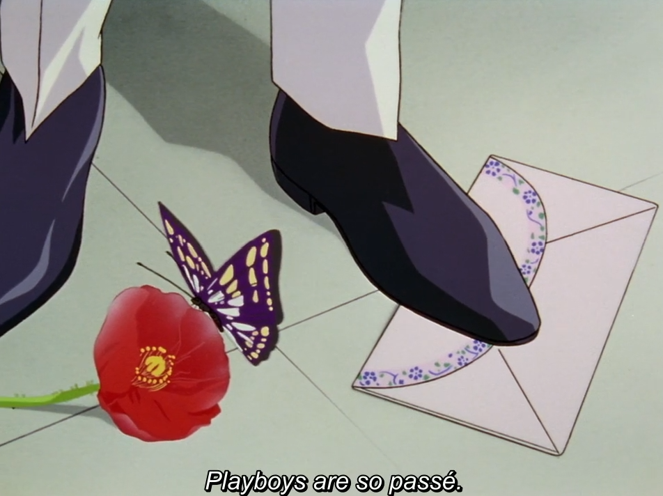 A close-up of a dark dress shoe stepping on a floral-bordered envelope, next to a red flower with a purple butterfly perched on it. The subtitle reads “Playboys are so passé.”